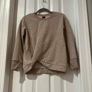 Tan sweatshirt with a little scrunched up part on right side in great condition
